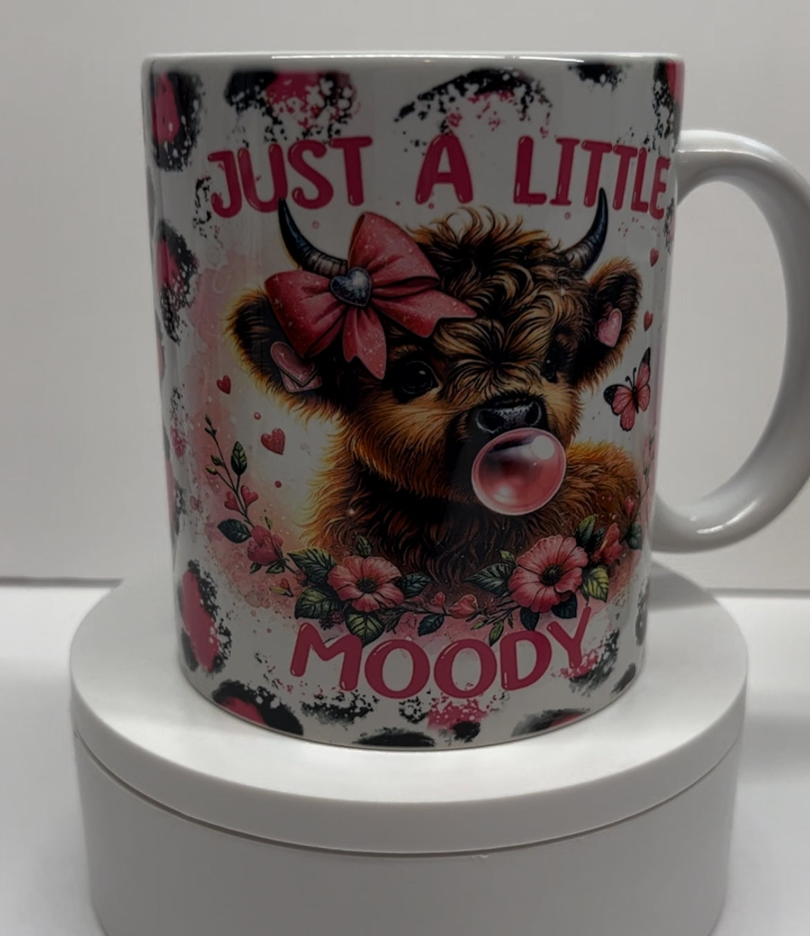 11 Ounce Coffee Cup Mug Cow with bright pink background and bubble gum