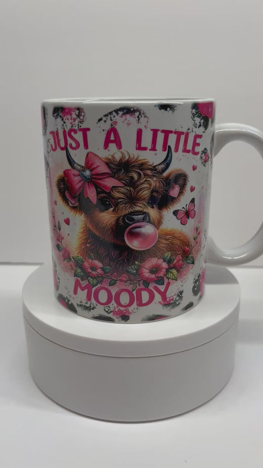 11 Ounce Coffee Cup Mug Cow with bright pink background and bubble gum